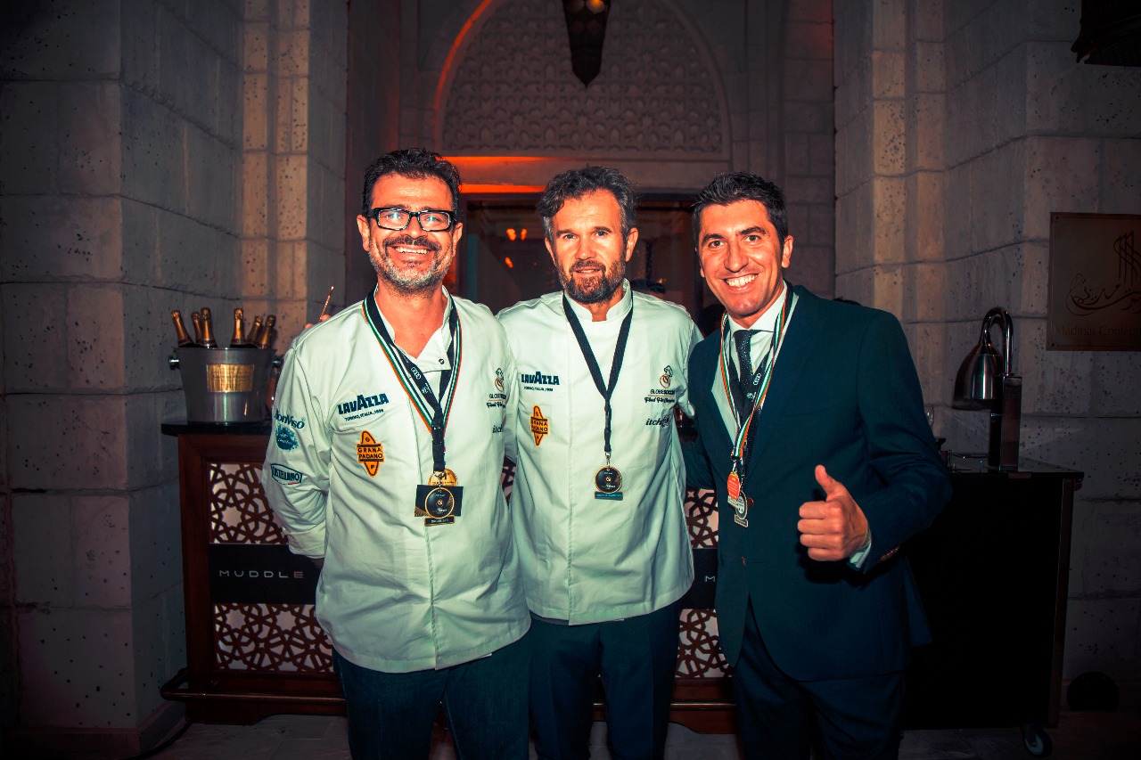 Jon Lorenz with two chefs at an international culinary event in Dubai